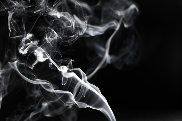 Photo close-up of smoke against black background