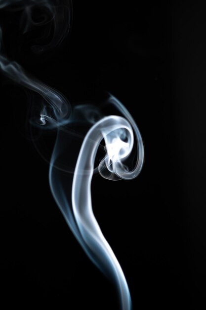 Photo close-up of smoke against black background