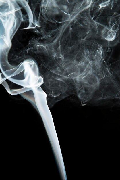 Photo close-up of smoke against black background