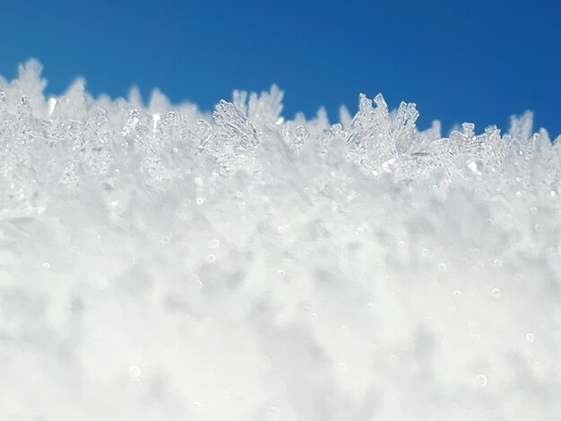Photo close-up of snow against sky