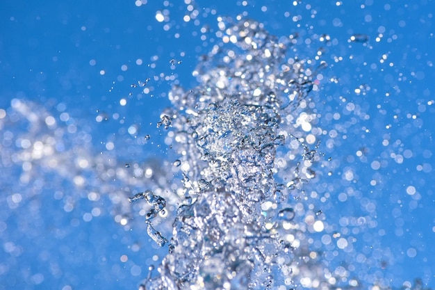 Close-up of snow on blue water