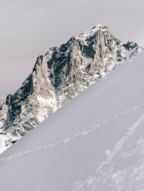 Close-up of snowcapped mountain against sky