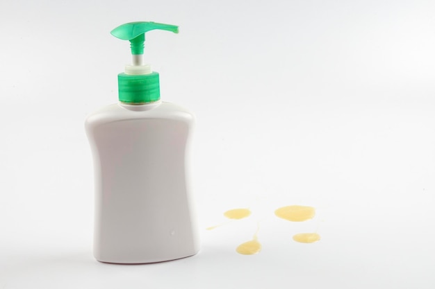 Close-up of soap dispenser against white background