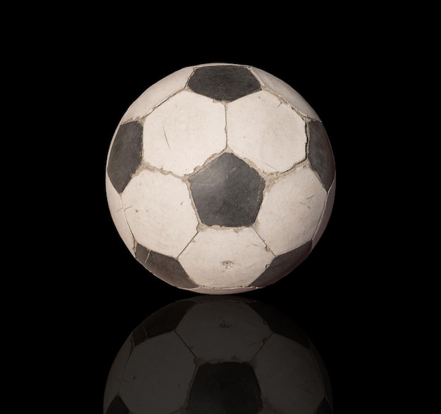 Close-up of soccer ball against black background