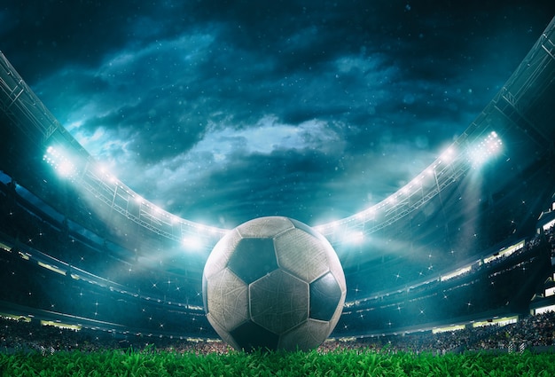 Premium Photo | Close up of a soccer ball in the center of the stadium  illuminated by the headlights