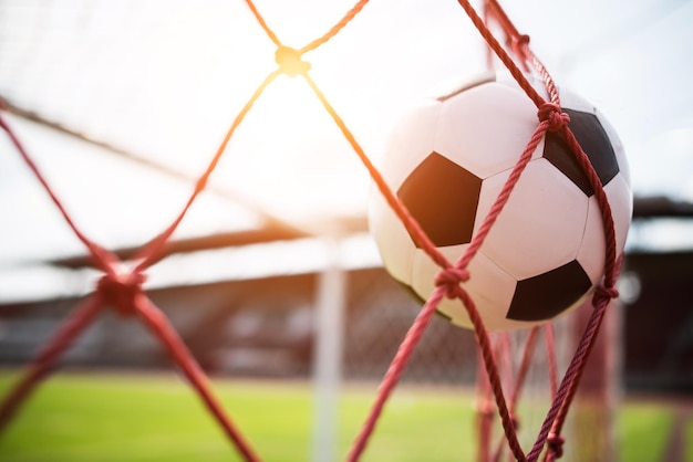 close-up of soccer ball hitting on net