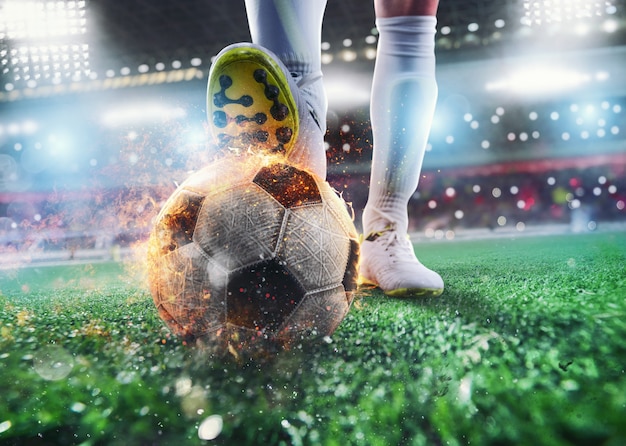 Photo close up of a soccer striker ready to kicks the fiery ball at the stadium