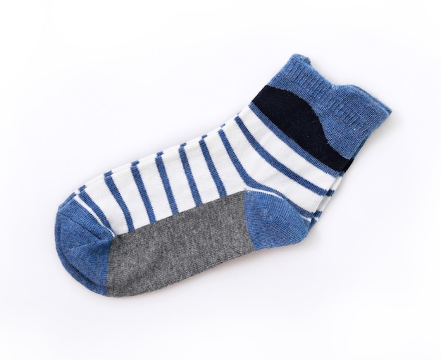 Close-up of socks over white background