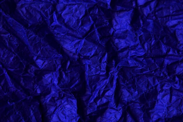 close up of soft crumpled blue paper and gift packing for holidays