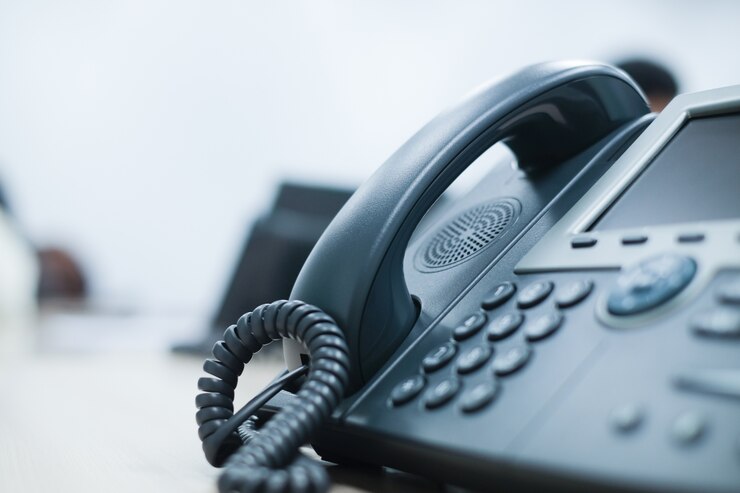 close up soft focus on telephone devices at office desk 