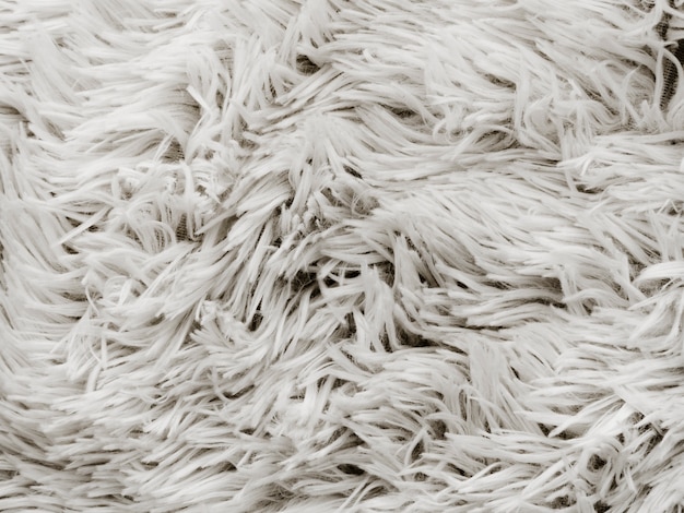 Close-up of soft white rug backdrop