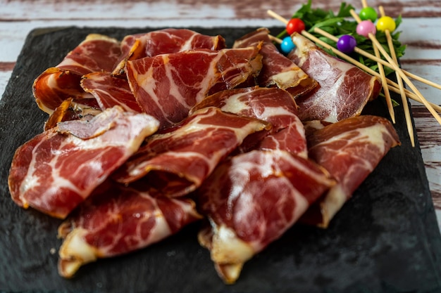 Close-up of some delicious pork bondiola fetas. High view.