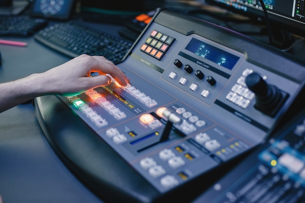 Close up of sound engineer hands recording music