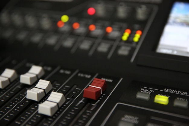 Close-up sound mixer in studio.