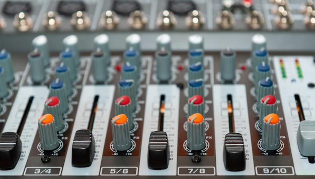 Close up of sound mixing console. Details of sound engineer room.