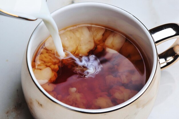 Close-up of soup in glass on table