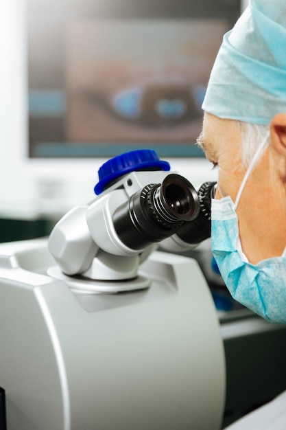 Close up of a special professional microscope being used by a smart doctor in the lab