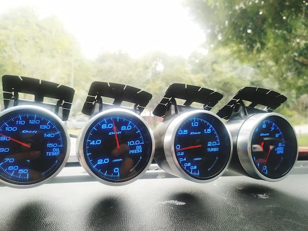 Close-up of speedometers in car