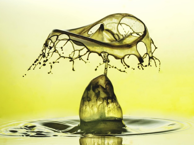 close-up of splashing water against green background