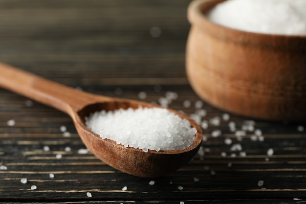 Close up on spoon and bowl with salt