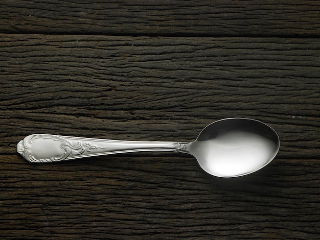 Photo close-up of spoon on table