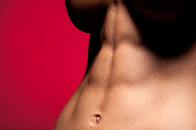 Close up of sporty slim woman with abs