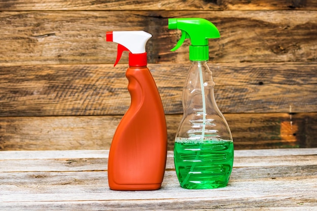 Close-up of spray bottles on table