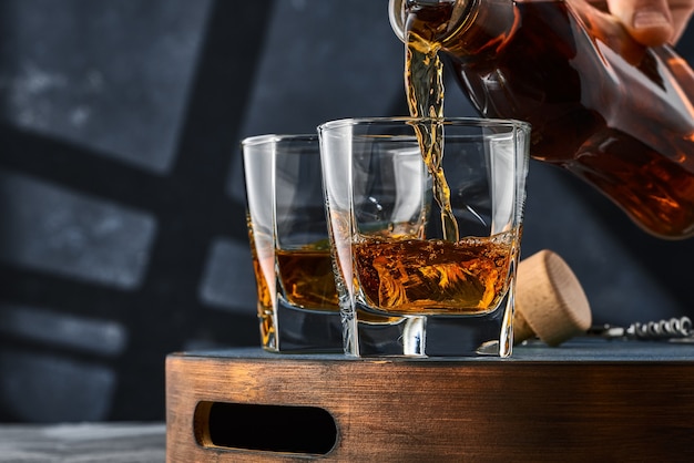 Close up of square glasses of whiskey with ice