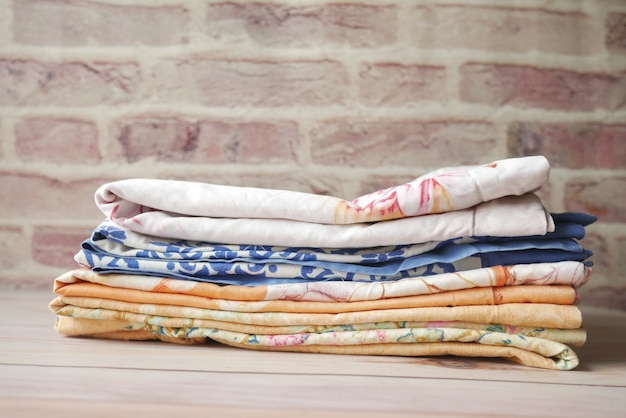 Close up of stack of clothes on table