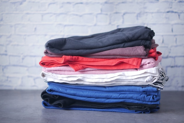 Close up of stack of clothes on table