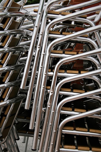 Close-up stack of empty chairs