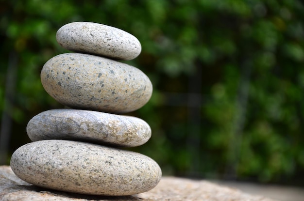 close-up stack of pebbles against blurred background