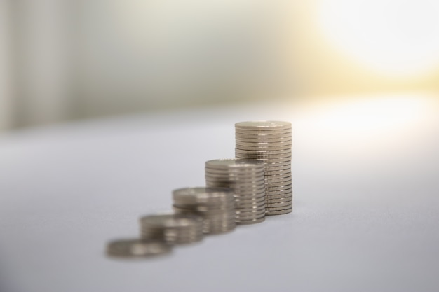 Close up of stack of silver coins with copy space.