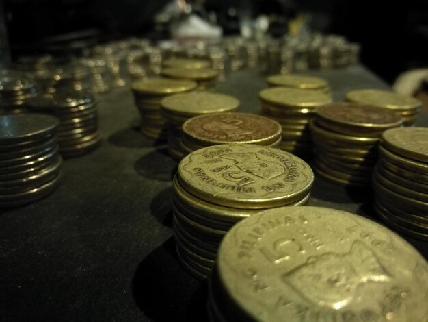 Close-up of stacked coins on table