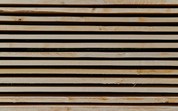 Close up of stacked wooden boards in a line