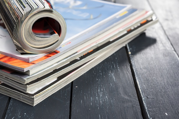 Close up stacking magazine place on table 