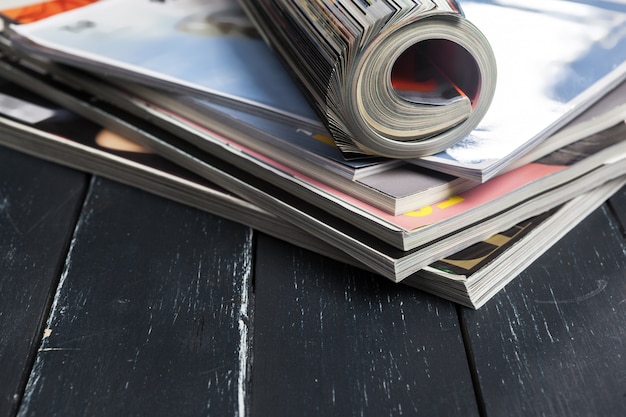 Close up stacking magazine place on table