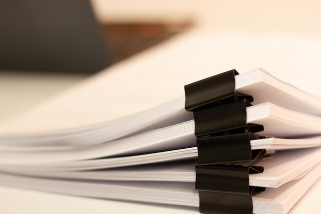 Close up of stacking office working document with paper clip on table