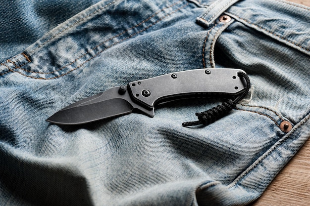 Close up stainless steel pocketknife with blackwash finish on blade and handle