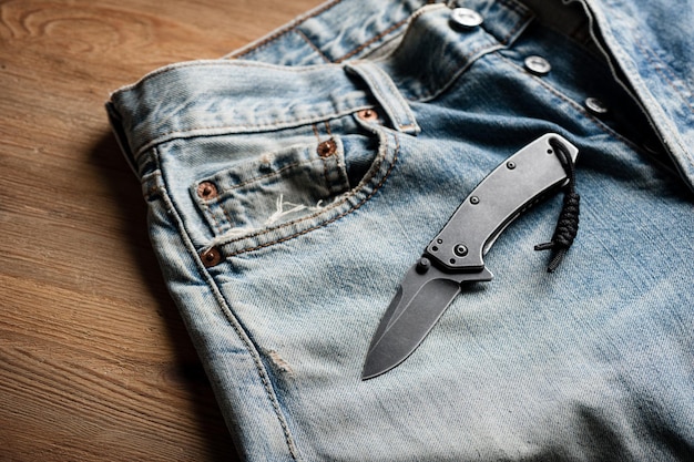 Close up stainless steel pocketknife with blackwash finish on blade and handle