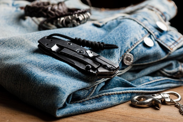 Close up stainless steel pocketknife with blackwash finish on blade and handle