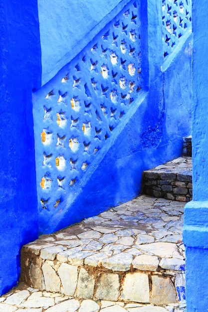 Close-up of staircase with blue railing