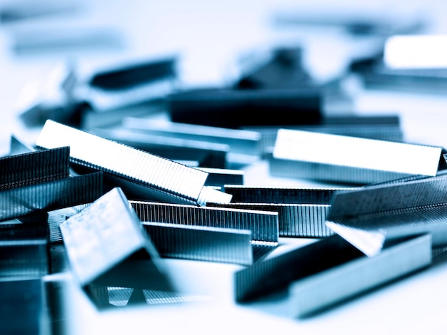 Photo close-up of stapler pins on table