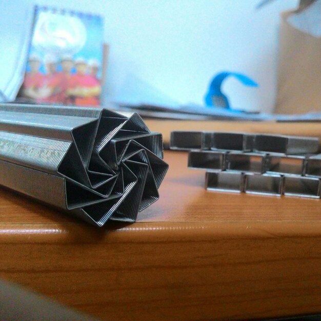 Photo close-up of stapler pins on table