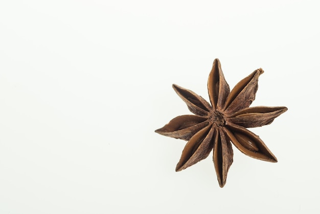 Photo close up of star anise against white background