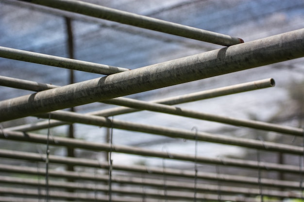 Close up Steel roof frame in garden texture background.