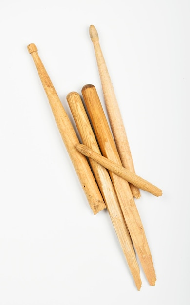 Photo close-up of sticks over white background