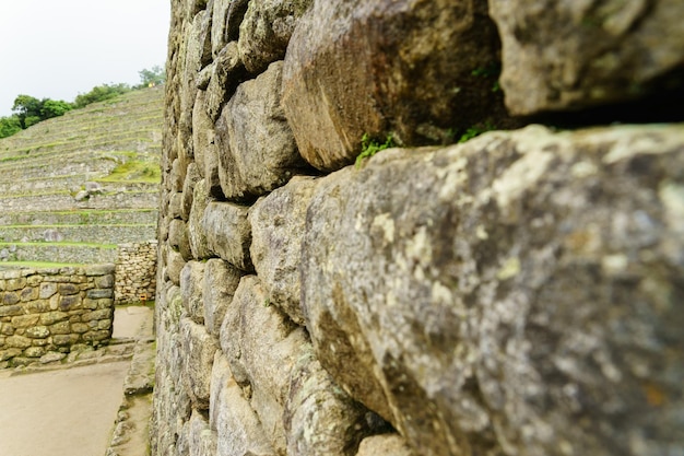 Foto close-up del muro di pietra a machu picchu