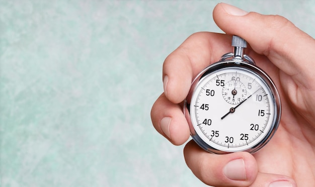 close-up stopwatch in human hand, timer