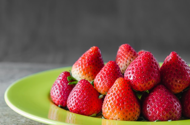 Close-up of strawberries in plate on table